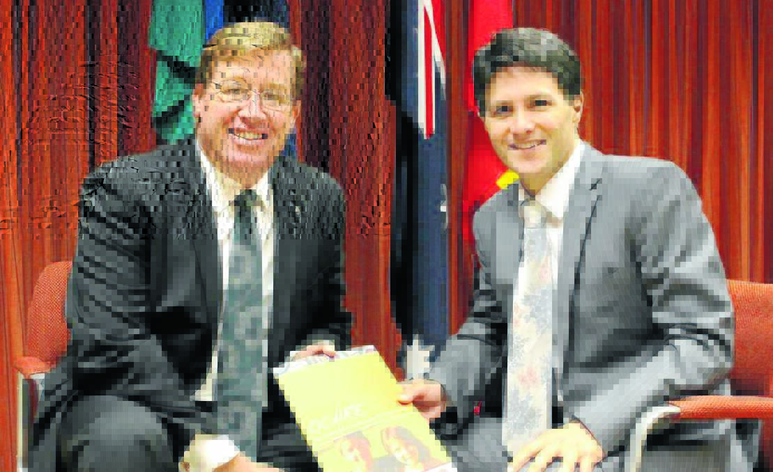 PROUD OCCASSION: State Member for Dubbo Troy Grant confers with NSW Minister for Aboriginal Affairs Victor Dominello before making his speech in the Wiradjuri and English languages.