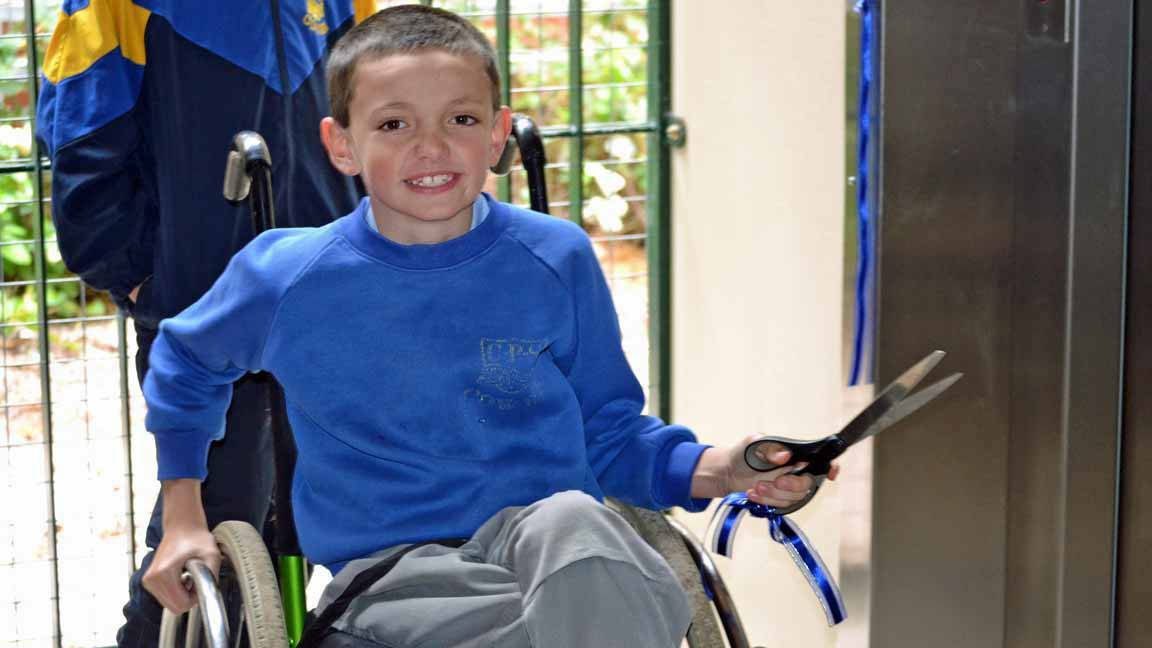 COWRA: For his first few years at Cowra Public School, year three student Justin Saxby used to have to leave his wheelchair in the office and climb up the stairs with the help of his friends whenever he wanted to use the school's library. 