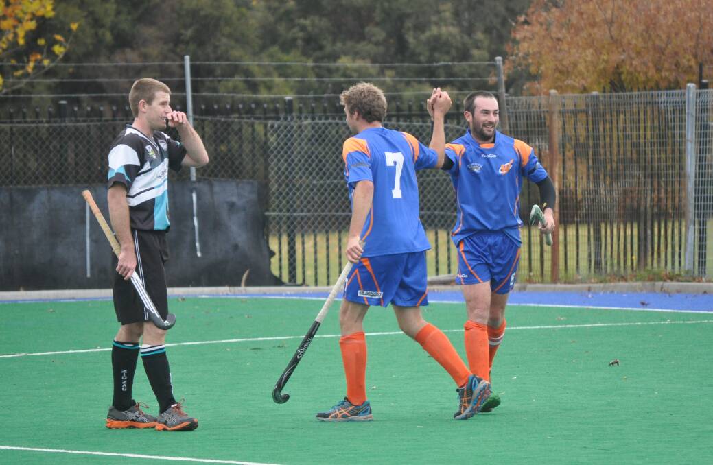 ON THE UP: Wanderers skipper Alex Said (right) is predicting a more focussed Orange team in today's men's Premier League Hockey clash with Souths. Photo: NICK McGRATH 0510nmhock7