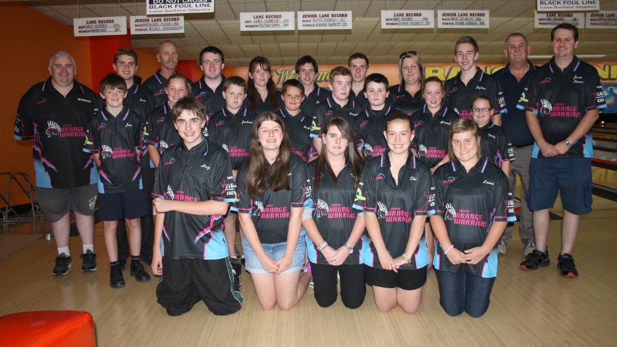 GOLDEN TEAM: Orange Junior Warriors and committee members were all smiled before the Australian Junior National Championships. Pictured are (back, left) Greg Flannery, Sam Johnston, Terry Betts, Nick Flannery, Jess Robinson, Jarrod Swallow, Hayden Swallow, Kelly Downey, Dylan McNabb, Michael McFadden, Jason Brown, (middle, left) Joel Patey, Katie Holmes, Joshua Harman, Bayley Swallow, Brandon McNabb, Sam Flannery, Micaylah Downey, Torz Downey, (front, left) Harry Betts, Alicia McFadden, Tash Brett, Chiara French and Lana Duncan-James. Photo: MICHELLE COOK 0408mctenpin