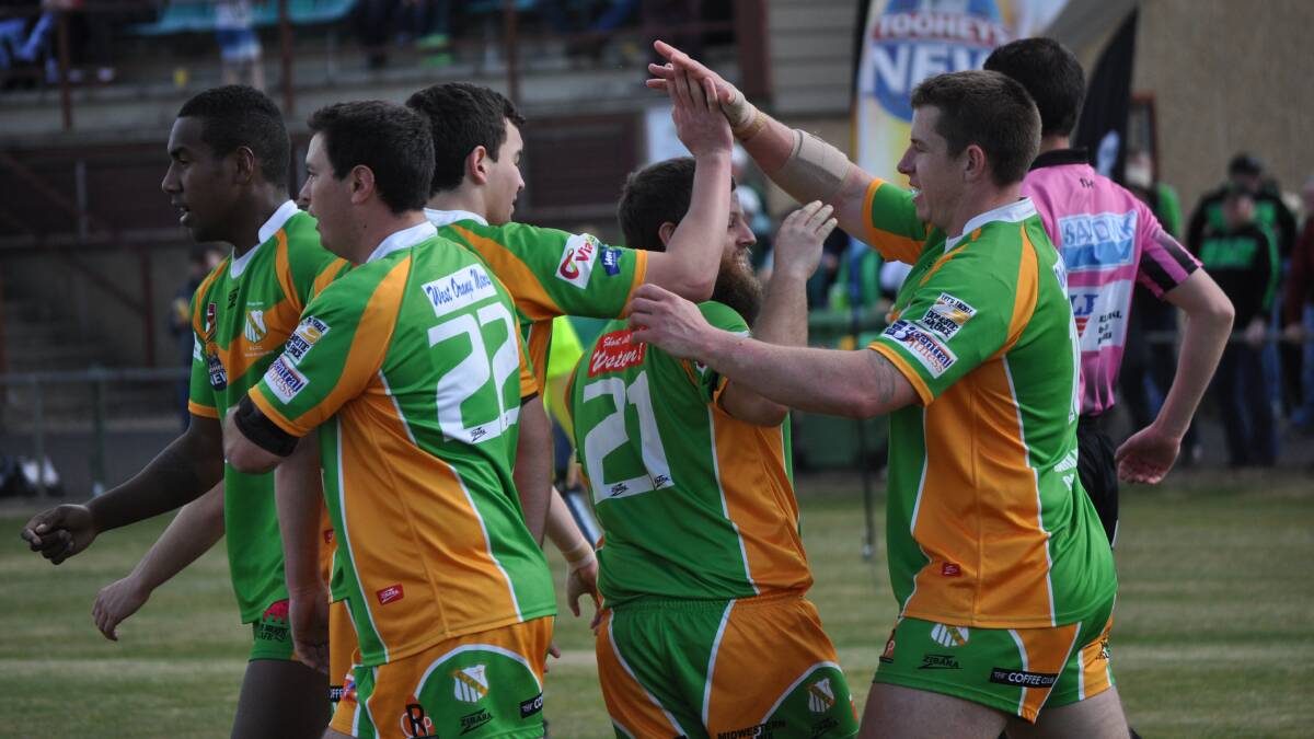 HIGH FIVES: CYMS first division players Anthony Redfern and Tom Stonestreet brush burly winger Craig Piper to perform a post-try high five during last week's 30-point win over Panthers. Photo: NICK McGRATH 0823nmreggies14