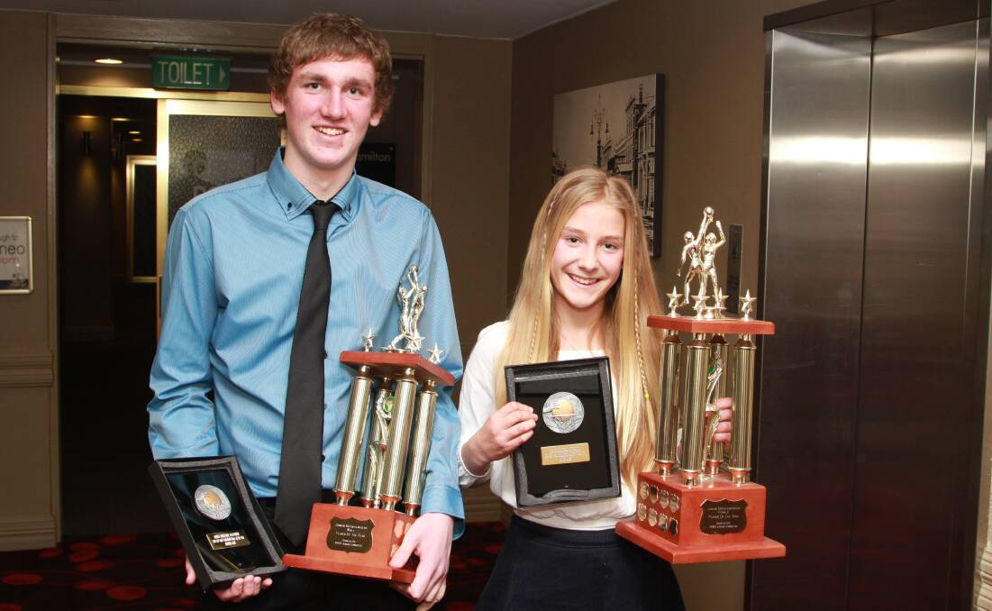 CENTRE OF ATTENTION: Orange Eagles Andrew Gray and Annie Miller won the 2014 Male and Female representative player of the year awards. Photo: JEFF DEATH 0725jdorgbballnews01