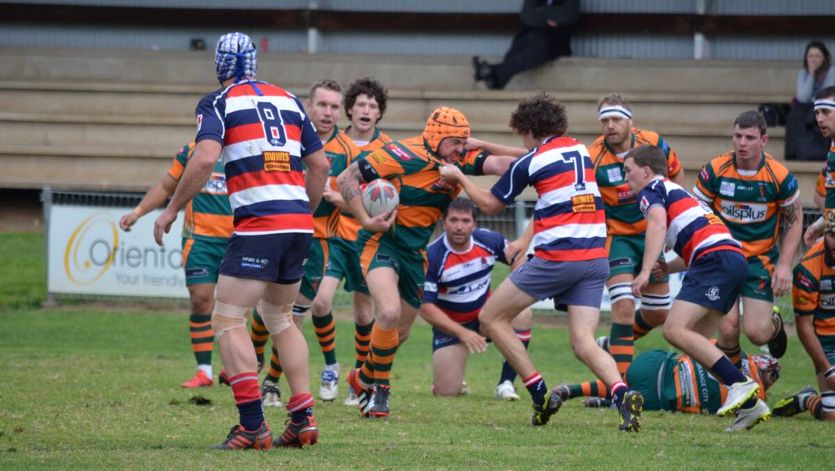 ON THE BALL: Orange City skipper Josh Tremain runs into the Mudgee defence during their Blowes Clothing Cup match. Photo: BEN HARRIS