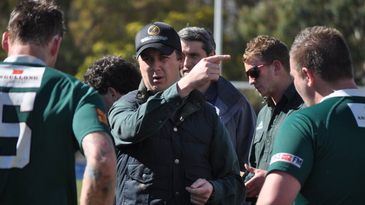 LAY DOWN THE LAW: Orange Emus second grade coach Mitch Dansey addresses his side at half-time of their minor semi-final victory last weekend. Photo: NICK McGRATH 0831nm2nds5