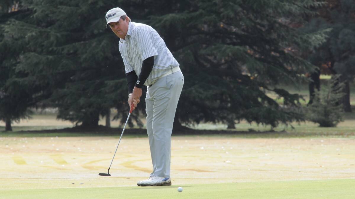PAYNE-FUL PUTT: Robert Payne watches a putt during his Duntryleague A grade club championship final win over Andy Campbell. Photo: JUDE KEOGH 0503duntrychamps1
