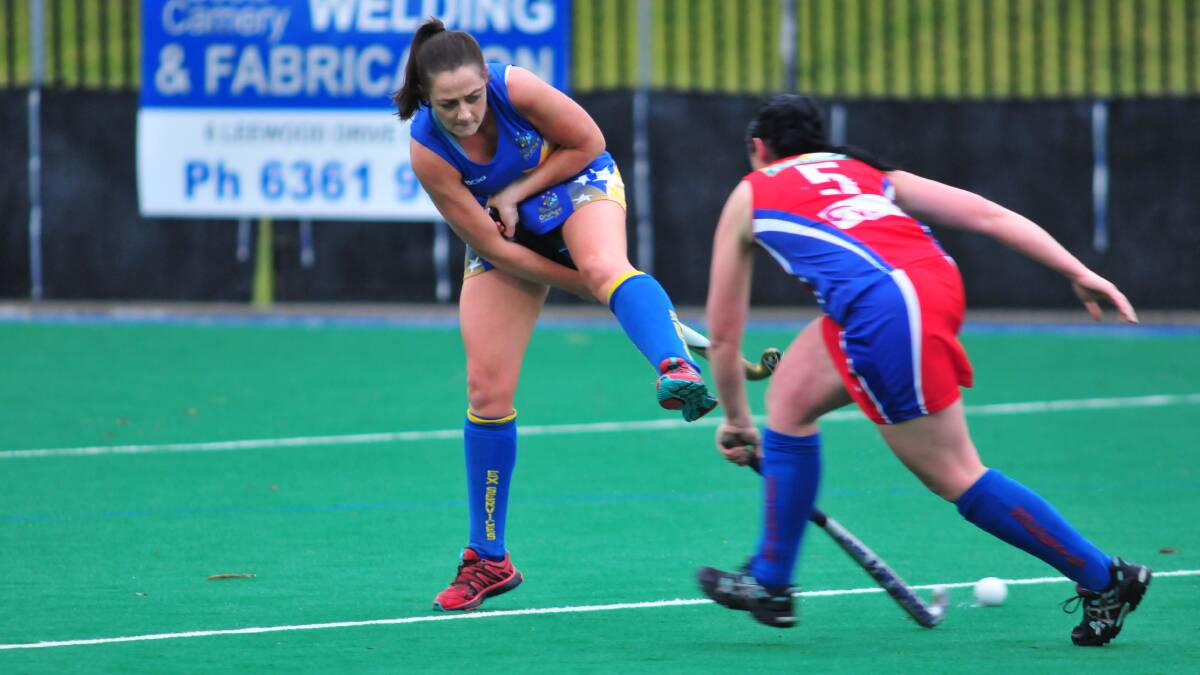 TRICK SHOT: Ex-Services' Leanne Kennewell pulls out some fancy stick work in Saturday's win over Confederates. Photo: JUDE KEOGH 0628hockey5