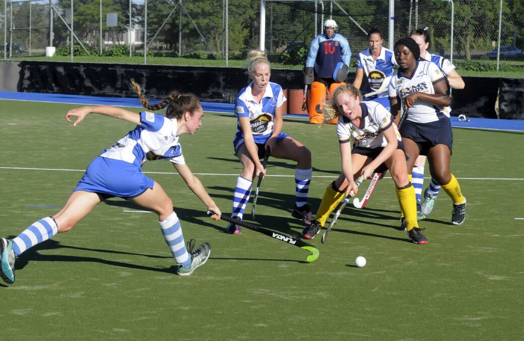 SWEET VICTORY: The only goal scorer of the match, Georgina McGregor (left) tangles with Siobhan Larkin of Kinross-CYMS. Photo: CHRIS SEABROOK 040514cpats2