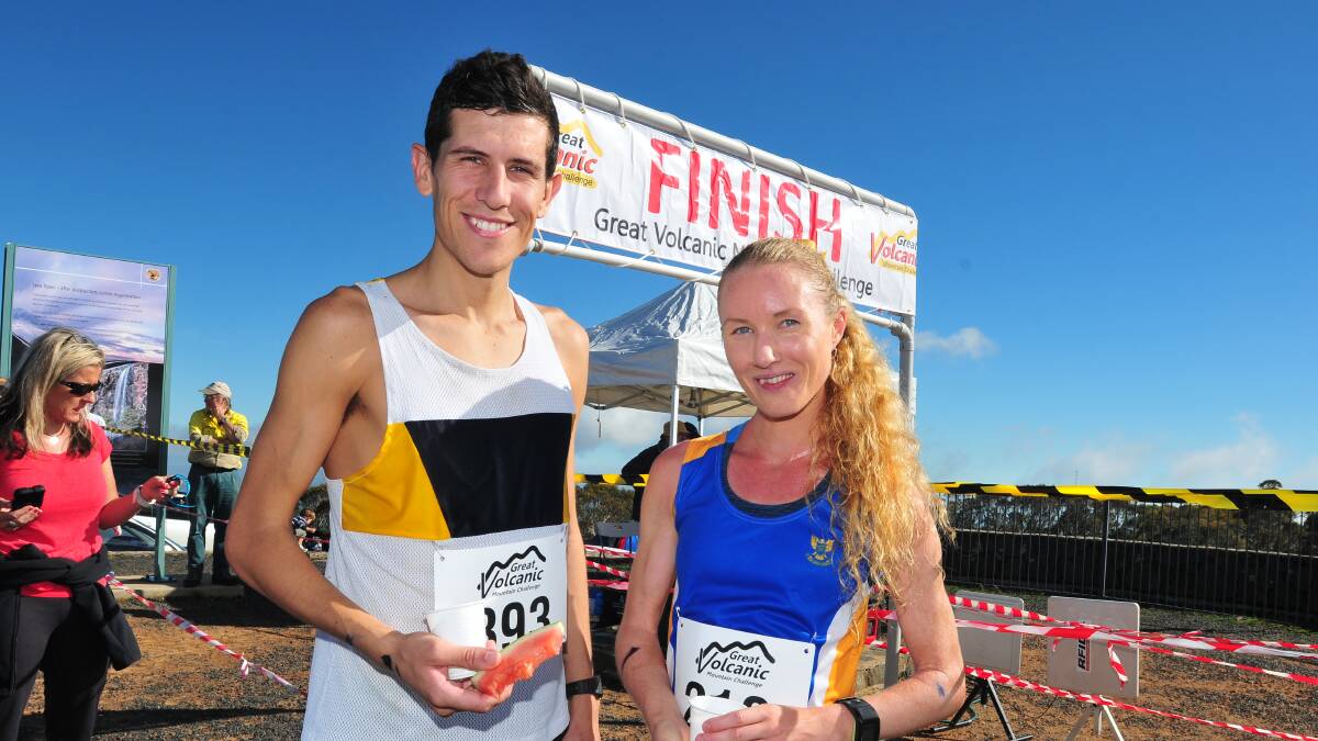 WINNERS: Thomas do Canto and Audrey Amiya-Hall were the first male and female up Mount Canobolas in 2014. Photo: JUDE KEOGH 0330volcanic8