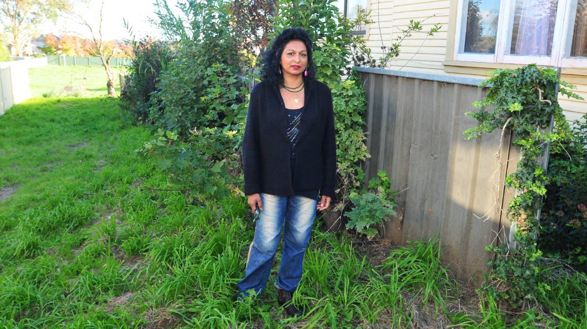 CLOSE NEIGHBOURS: Ten units will be built on Icely Road for affordable housing. Neighbour Shakuntala Solanki has privacy concerns. Photo: JUDE KEOGH 0416units3