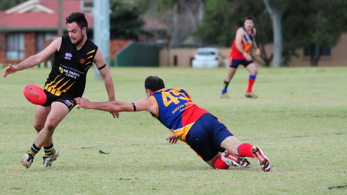 KICKING ON: Orange Tigers' gun Simon Ewin sends it forward in his side's 176-point win over Dubbo on Saturday. Photo: DAILY LIBERAL