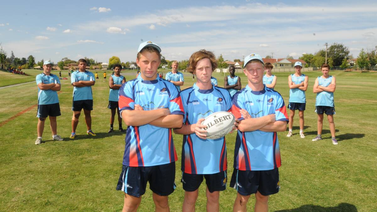 GOLDEN BOYS: Western NSW Junior Gold Cup squad members Charlie Mortimer (front, left), Kyle Gibson and Lachlan Stewart, flanked by their teammates. Photo: LUKE SCHUYLER 0212lsrugby1