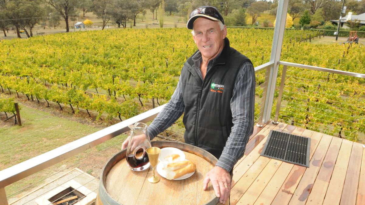 BREAKING THE BREAD: Mortimers Wines owner Peter Mortimer will host a Blessing of the Harvest at his vineyard on Sunday. Photo: JUDE KEOGH 0407harvest2