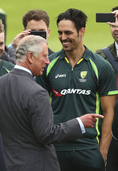 JOLLY GOOD JOKE: Mitch Johnson enjoys what was probably a rip-snorting one-liner from Prince Charles. Photo: GETTY IMAGES