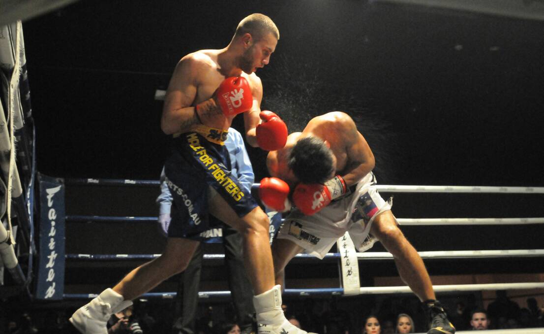CHAMPION: Orange boxer Sam Ah-See takes on Arnel Tinampay at the Orange Function Centre on Friday night. Photos: JUDE KEOGH 0724fightahsee10