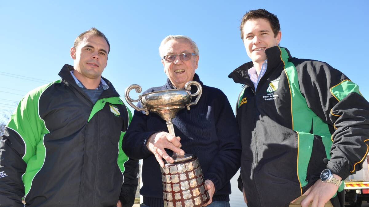 CRUNCH TIME: Mick Sullivan, member of the 1954 winning Clayton Cup CYMS team Vic Byrne and Tim Bassmann, pictured with the Clayton Cup. Photo: NICK McGRATH 0808nmclayton1