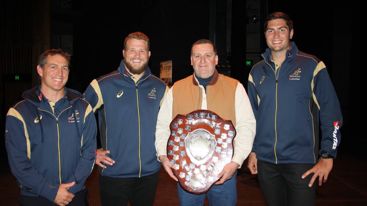 SHIELDED: The 2013 Orange Credit Union Sportsperson of the Year Dave Oates (second right) is presented with the shield by Wallabies' head performance coach Scott Murphy (left) and players James Slipper (second left) and Rob Simmons (right). Photo: MICHELLE COOK 0805mcawards1