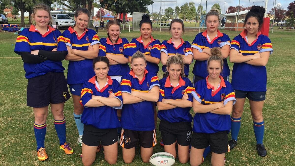 STATE CHAMPIONSHIP BOUND: The James Sheahan open girls’ sevens rugby team includes (back left) Georgia Parr, Erin Turner, Paris McNaught, Abbie Ranse, Jessica McLean, Keagan Byrnes, Ellie Madden, (front, left) Maggie Gorham, Olivia McClure, Holly Gibson and Brigette Jasprizza. Photo: CONTRIBUTED