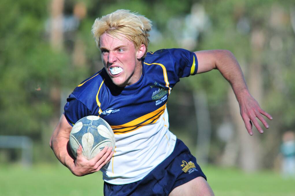 ON THE BALL: ACT’s Byron Hollingworth-Dessent during the final.  Photo JUDE KEOGH 0609rugby15