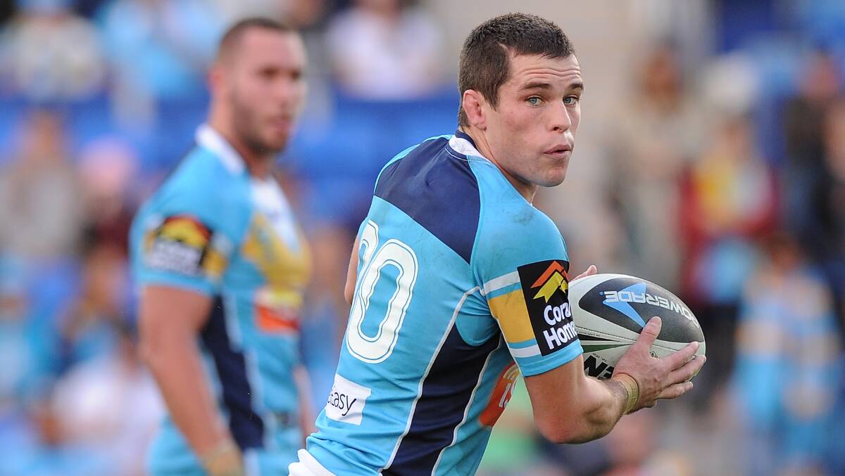 ON HIS GAME: Orange's Daniel Mortimer looks to get a pass away in his debut with the Gold Coast Titans against St George Illawarra on Sunday. Photo: GETTY IMAGES