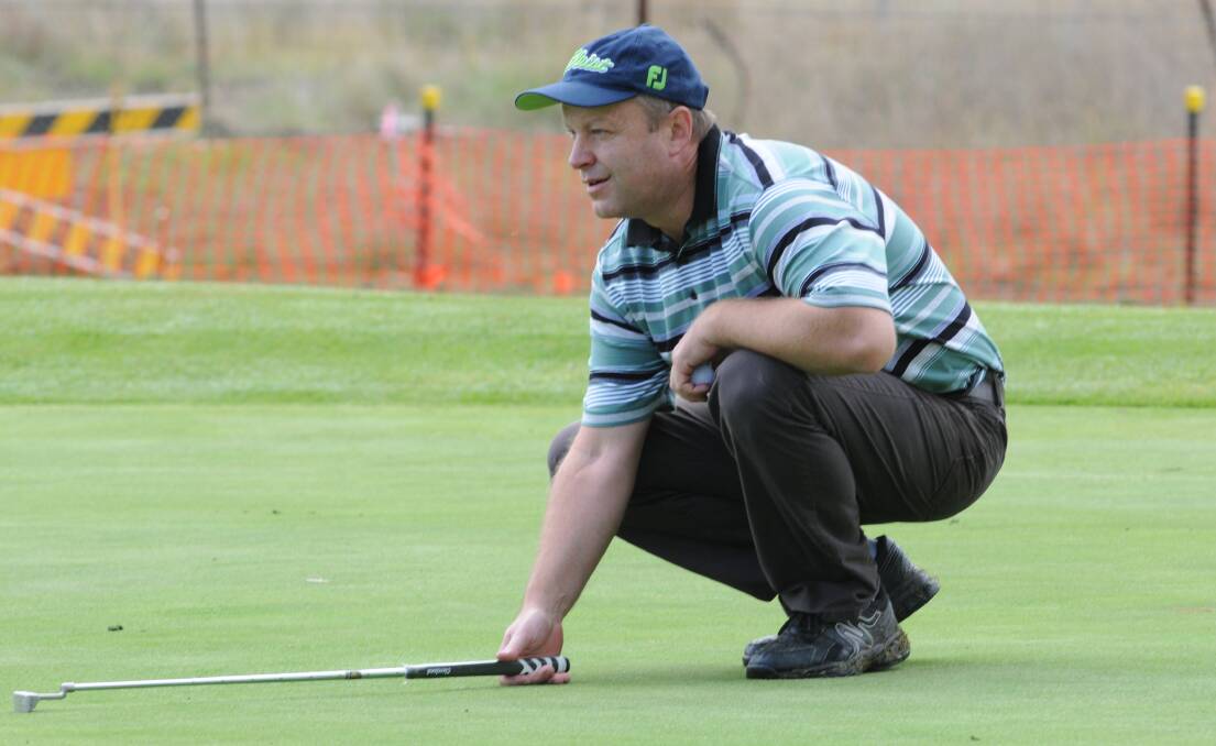 WINNER: Dave Chippendale lines up a putt on his way to winning the Orange Ex-Services A grade club championship on Sunday. Photo: JUDE KEOGH 0503countrychamps2