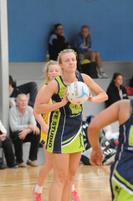 OUT IN FRONT: Mardi Aplin will lead an understrength Life Studio against Robin Hood in today's Toyota Cup grand final rematch. Photo: JUDE KEOGH 0524netball7