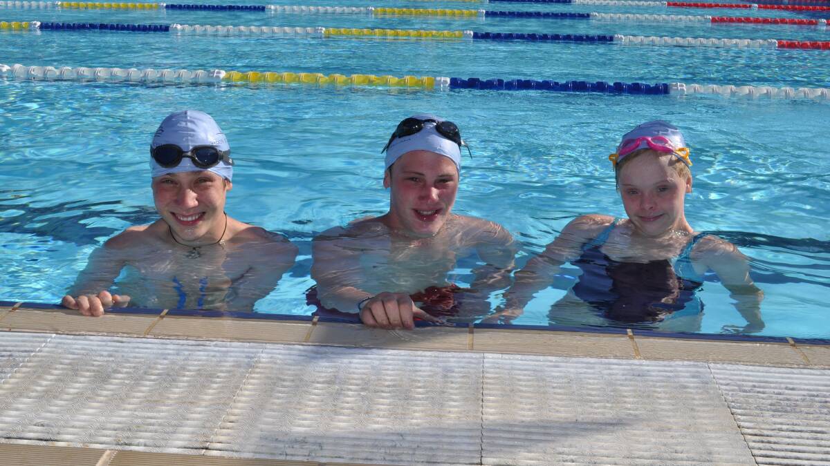SPLISH SPLASH: Jay Reed, Anthony, and Lottie Graham get in some extra laps before swimming at Homebush next month. Photo: NICK McGRATH 0313nmswim2