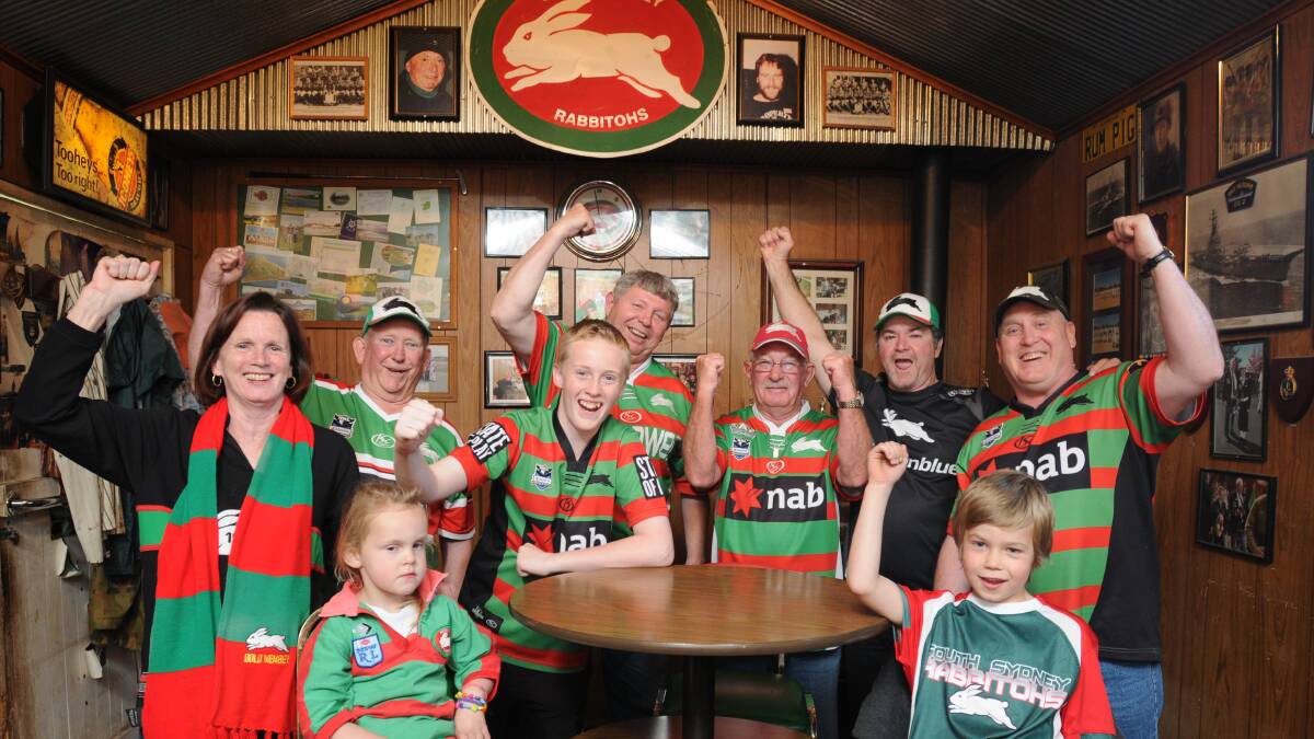 GO THE RABBITOHS: Among Orange’s most dedicated South Sydney supporters are Julie Fisher, Tom Hall, Mitch Anderson, Bruce McAlpine, Barry Goodlock, Charlie Fisher, Dave Anderson and (front) Kaylee Anderson and Paterson Brown. Photo: STEVE GOSCH 0928rabbitohs1
