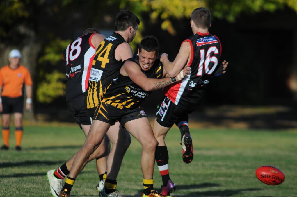 HIP AND SHOULDER: Joel Ryder takes out a Young opponent in Sunday's Central West AFL clash. 						               Photo: STEVE GOSCH  0511sgafl2