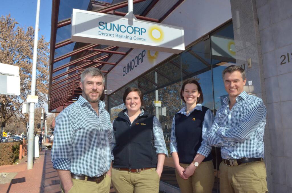 SHIFTED: Suncorp's Al Hattersley, Sally Wills, Pip Wills and Ben Graystone outside the new office. Photo: DECLAN RURENGA