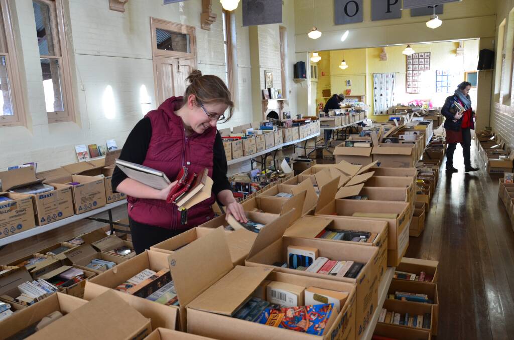 PICK AND CHOOSE: Rebecca Slaven picks out a few good reads at Orange Public School. Photo: DECLAN RURENGA