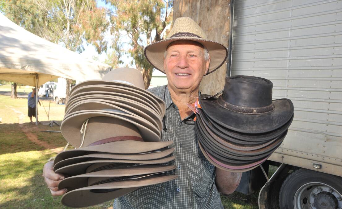 HATS OFF: John Lulham holds up some of the 5000 hats to be displayed during the Australian National Field Days. Photo: JUDE KEOGH 1024jkfield2