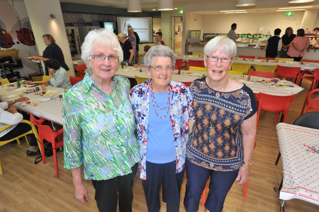 CARING: The hospital auxiliary's Judy Curtin, Doreen Thurtell and Joy Wilkinson were among 350 volunteers thanked by the Orange Health Service for their service. Photo: JUDE KEOGH 1208jkvol1
