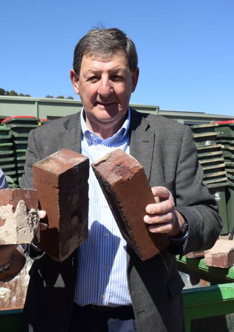 ALL GONE: Mayor Reg Kidd with some of the maternity ward bricks.