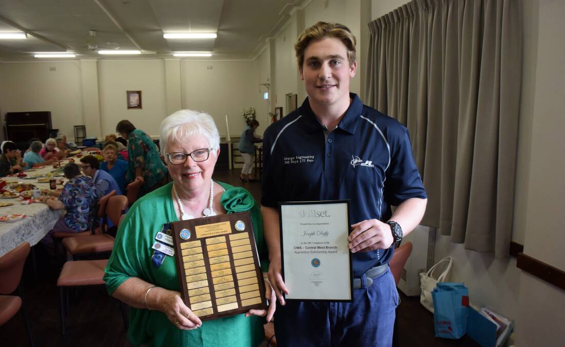 SUPPORT: Apprentice Joseph Duffy receives an award from the CWA's Helena Davidson.