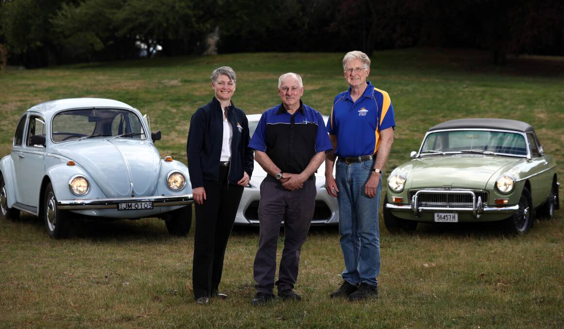REVVED UP: Orange Daybreak Rotary club members Joanne McRae, Tony Agland and Graham Denny are encouraging people to bring out their classic cars this weekend. Photo: ANDREW MURRAY 1009amrot18021