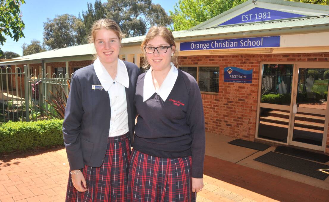 ONE DOWN: Orange Christian School students Nerida and Tahliya Chambers said the first English HSC exam was better than the trial test. Photo: JUDE KEOGH 1016jkhsc1