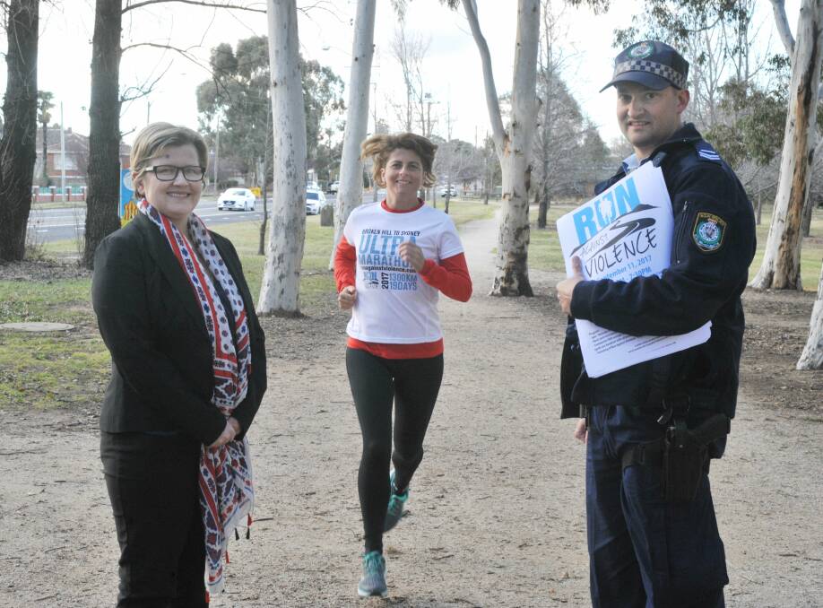 RUNNING FOR A CAUSE: Supporting Kirrily Dear and her Run Against Violence is Housing Plus' Penny Dordoy and Senior Constable Granton Smith. Photo: JUDE KEOGH