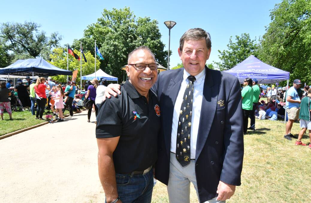 LANGUAGE MATTERS: NAIDOC Week committee chairman Gerald Power with mayor Reg Kidd at Robertson Park following the official opening on Monday. Photo: JUDE KEOGH