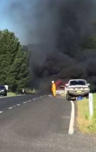 Fire has engulfed a car on the side of the Mitchell Highway. Photo: FACEBOOK