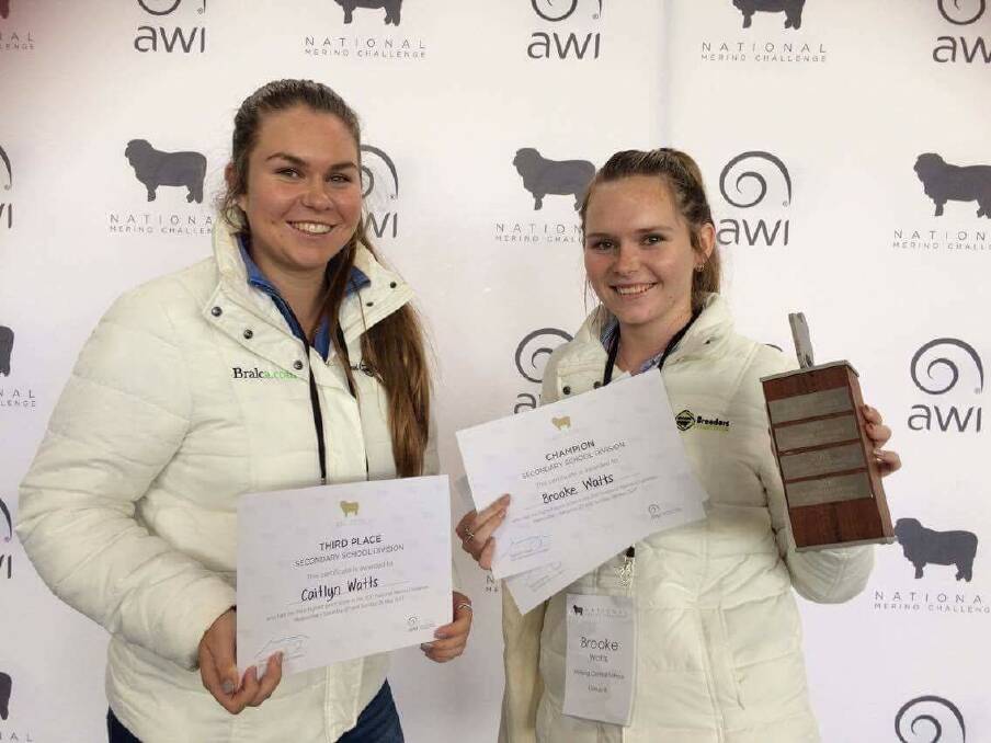 QUALITY FLEECE: Molong students Caitlyn and Brooke Watts show off their prizes from the National Merino Challenge. Photo: MOLONG CENTRAL SCHOOL