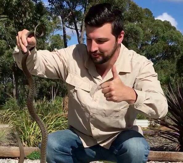 IN GOOD HANDS: Jake Hansen with an Eastern Brown snake caught in Orange. Photo: CONTRIBUTED