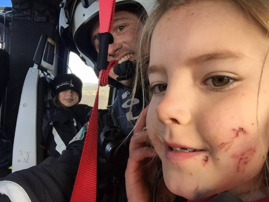 HAPPY ENDING: Marley Aplin and her friend Rhianna were winched to safety onto POLAIR after being found at 11.30am on Sunday. Photo: NSW POLICE