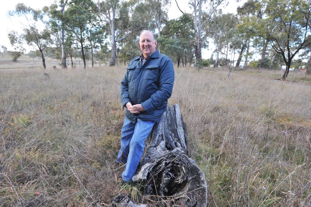 NATIVE FLORA: Col Bower has been inducted as a life member of the Orange Field Naturalist and Conservation Society. He's pictured just off Cadia Road where one of the few remaining remnants of native bush land which covered Orange can be seen. Photo: JUDE KEOGH 0720jkbush1