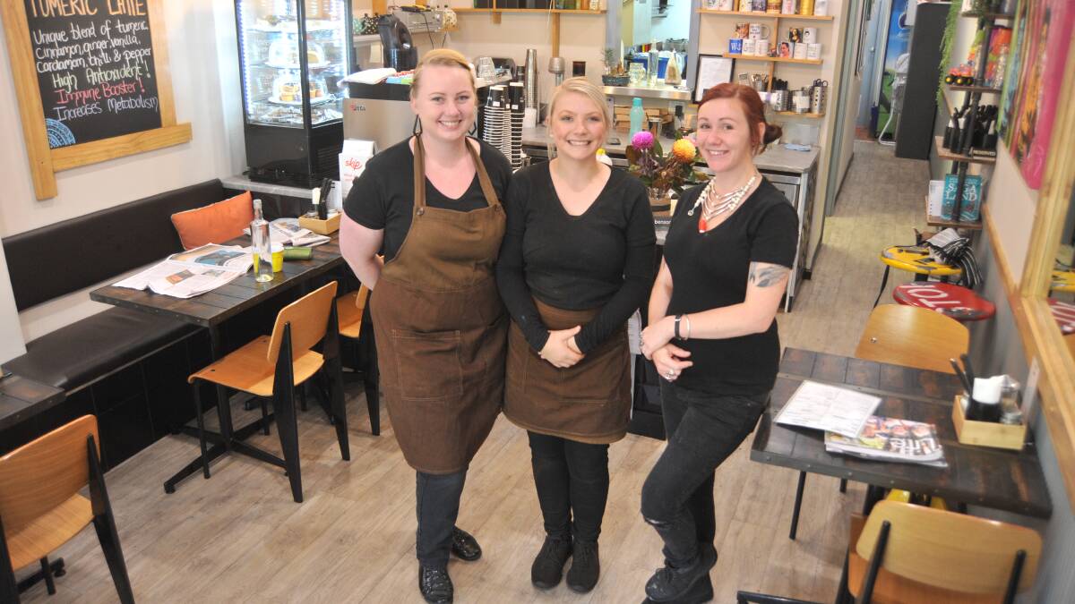 TRADE: Bensons Cafe's Taylor Zarnow, Claudia Billiau, Sarah Wells won't be working on Boxing Day with the cafe to be one of the stores which will not open. Photo: JUDE KEOGH