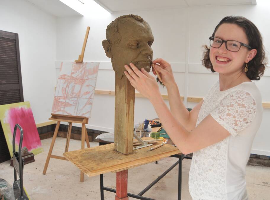 SCULPTED: Artist Hanli Uys hard at work crafting a sculpture in her studio. Photo: JUDE KEOGH 1019jkhanli3
