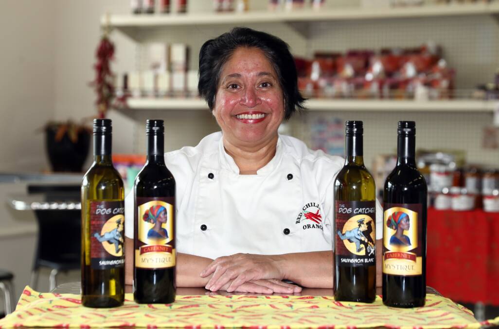 CHUFFED: Red Chilli Deli's owner Ayoma Gooneratne with her first wine show medal winners. Photo: ANDREW MURRAY