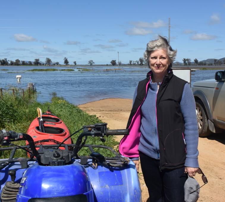 DOOR STOP: Farmer Sarah Black at the front gate of Riversleigh on the Forbes to Condobolin Road. 