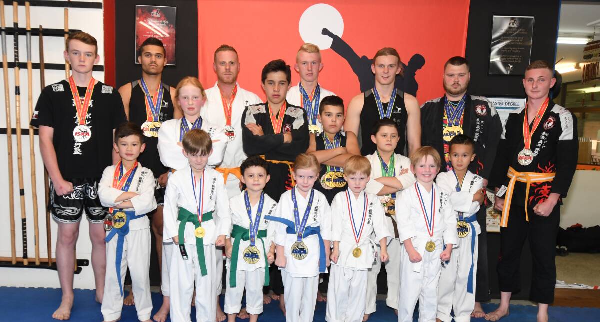 CHAMPIONS: A host of Pollet's Martial Arts students won medals at Bathurst's regional event last weekend, competing in Jiu Jitsu, Karata and kickboxing. Photo: JUDE KEOGH