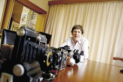 FOCUS ON CAMERAS: Jennifer Davidson and the collection of cameras she has acquired as technology has changed.