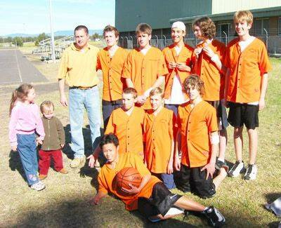 WINNING COMBINATION: Orange men’s under 16 basketball team which finished second in NSW Country Championships Division 3. Pictured are (back l-r) Grant Cole (coach),Tom Chilcott, Ben McKenna, Luke Griffiths, Drew Morcom, Michael Booney, (middle) Brock Fitzgerald, Ben Barker, Callum Baillie, Ali Isbester (with ball) and mascots Taylor and Jay Cole.